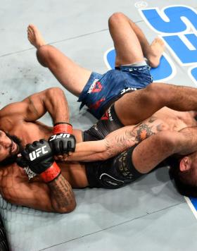 Demetrious Johnson secures an arm bar submission against Ray Borg in their UFC flyweight championship bout during the UFC 216 event inside T-Mobile Arena on October 7, 2017 