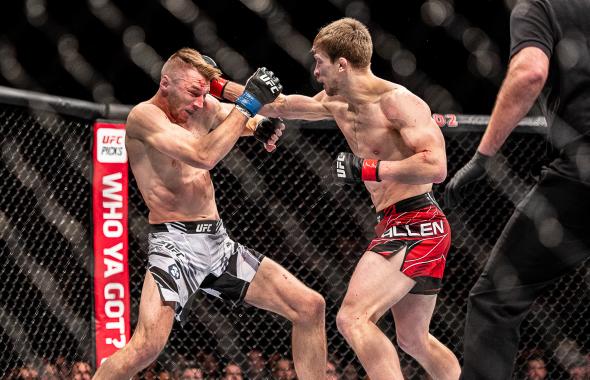 Arnold Allen punches Dan Hooker at O2 Arena on March 19, 2022 in London, England. (Photo by John Barry/Zuffa LLC)